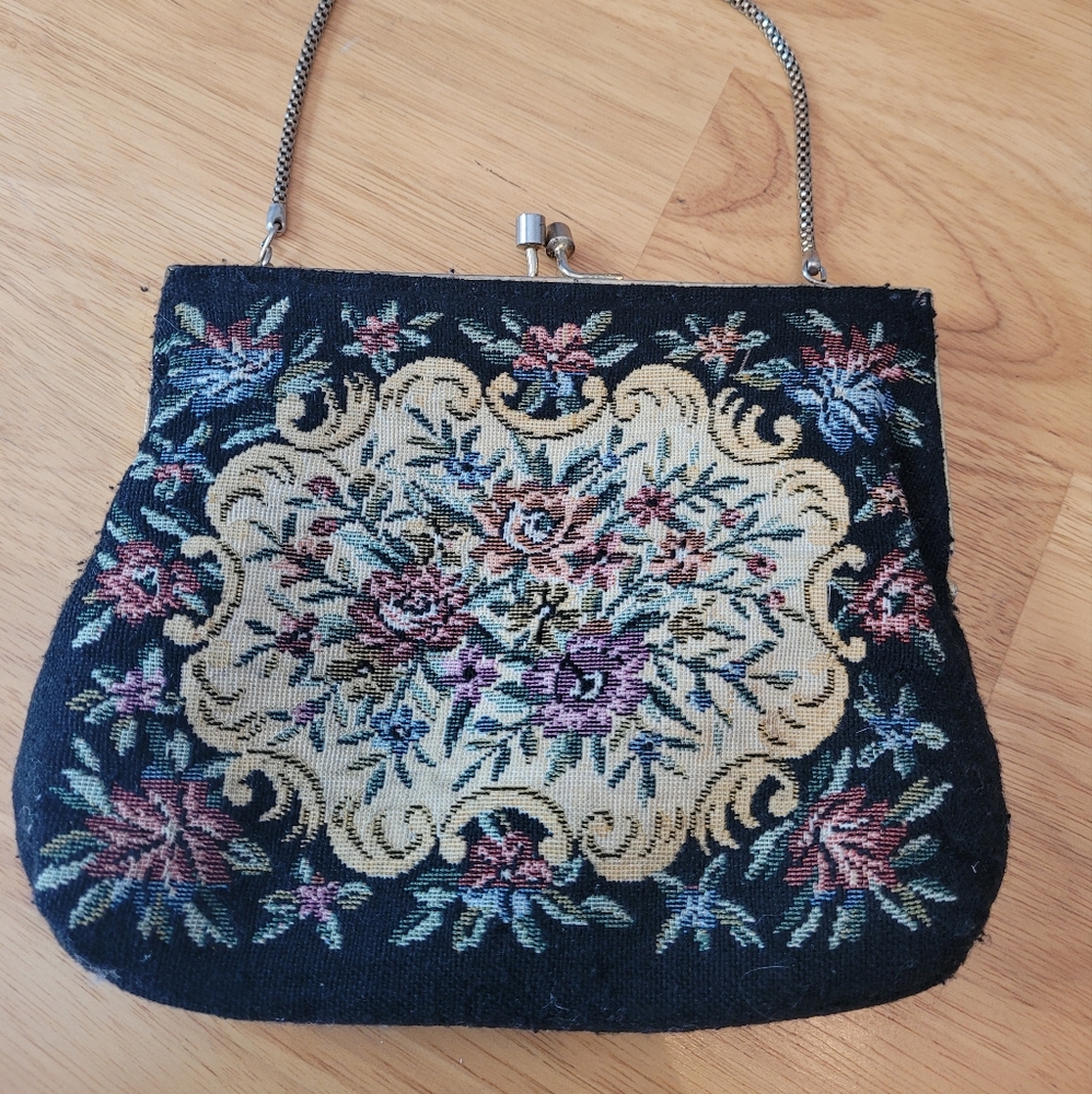 Vintage 90's carpet hand bag. Floral design on black with gold accents.